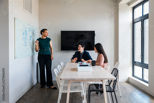 Businesswoman in a meeting with colleagues