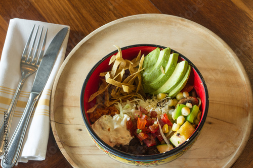 Mexican food: Bowl of avocado, and tomato salad.