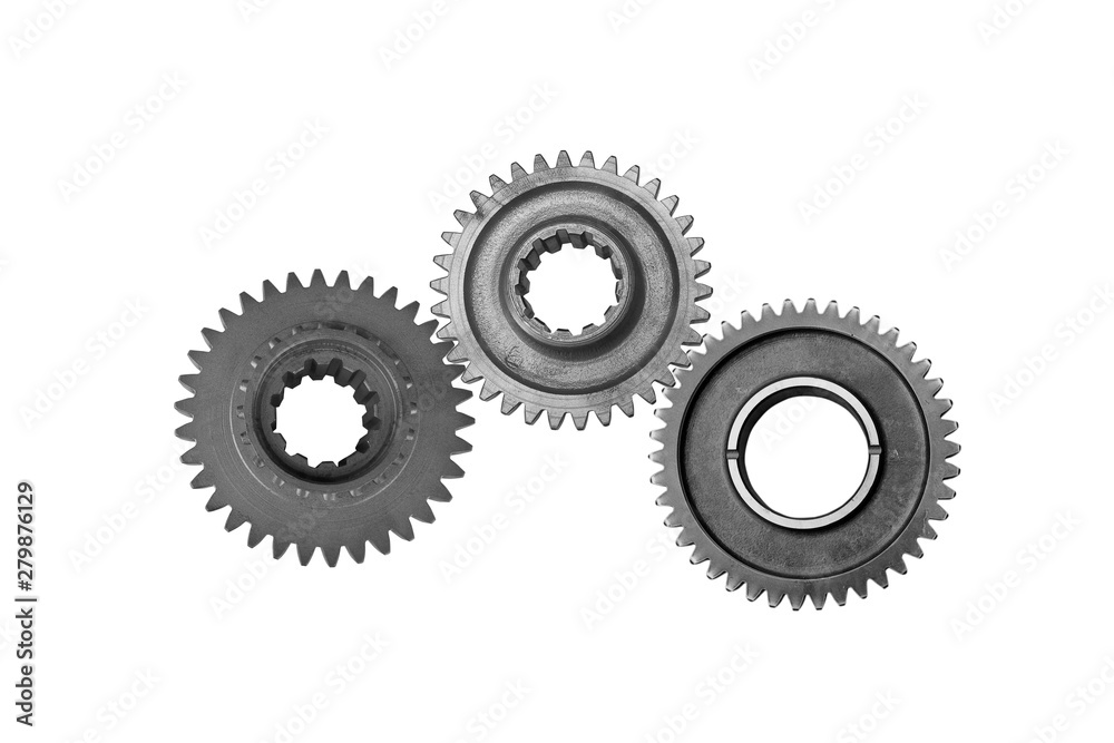 Interlocking metal gears isolated on a white background. Cogwheel industrial background. Interlocking metal gears isolated on a white background. Cogwheel industrial background.