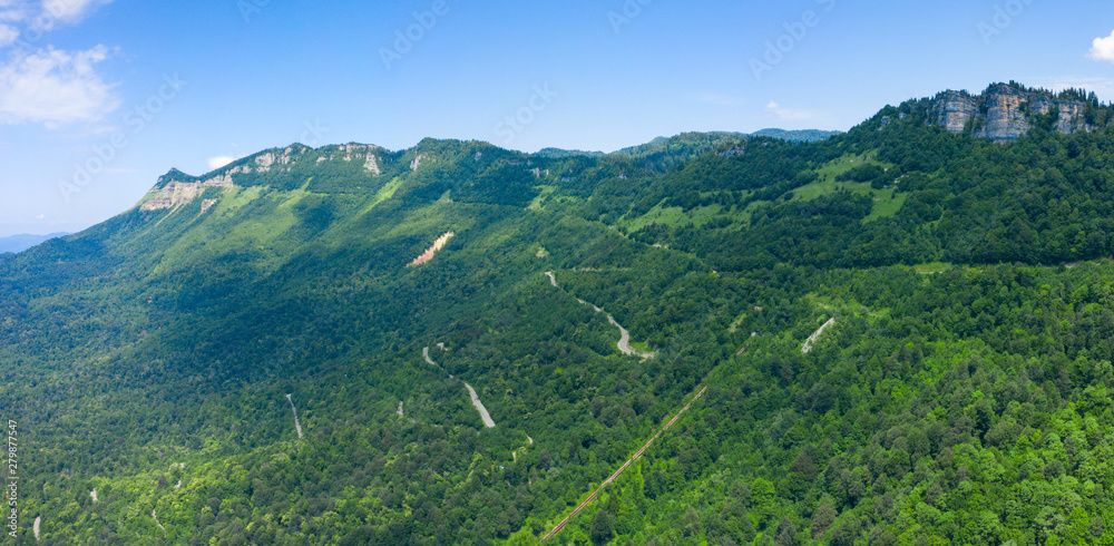 Obraz premium Amazing view of the landslide on a mountain road near Naqerala Pass and Cxrajvari mountain. Serpentine road and old rockfall in Ambrolauri District. Georgia