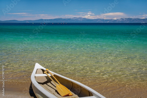 Canoe on the shore of beautiful Lake Tahoe- Crystal clear turquoise water © pascale