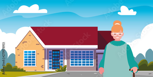 grandmother standing in front of the house