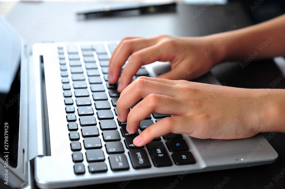 Close-up of typing female hands on keyboard Close-up of typing female hands on keyboard
