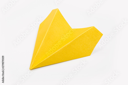 Yellow paper airplane isolated on white background. top view