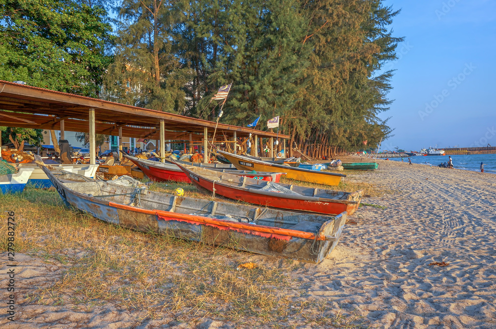 MALACCA, MALAYSIA - 2 April 2016 - Fishermen boats at the beach. Fishermen are the main occupation for villagers at Malacca village, Malaysia