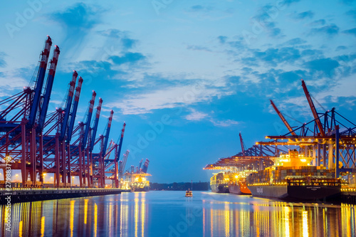 Cargo ships being loaded at Burchardkai in Hamburg Harbor at night, Waltershofer Hafen, Hamburg, Germany