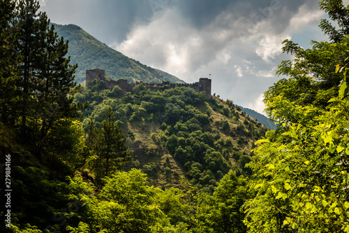 Ruins of medieval fortress Maglic on top of hill by the Ibar river in Serbia. Valley of this river is also called Lilac valley. photo