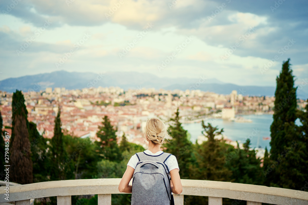 Travel by Croatia. Young traveling woman enjoying the view of Split city. Travel by Croatia. Young traveling woman enjoying the view of Split city.