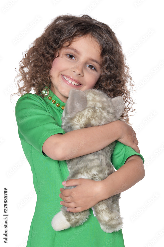 portrait of cute little girl posing in green dress