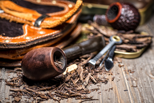 Obraz na plátně Wooden pipe with tobacco on wooden table