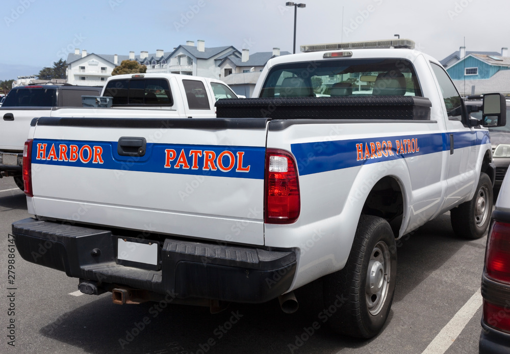 Half Moon Bay, California Harbor Patrol truck parked on quay. Half Moon Bay, California Harbor Patrol truck parked on quay.