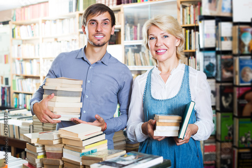 Man and woman holding books