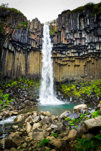 Svartifoss waterfall in volcanic mountains Iceland