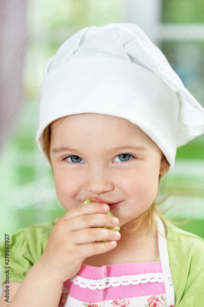 Cute girl eating delicious fresh salad in kitchen Cute girl eating delicious fresh salad in kitchen
