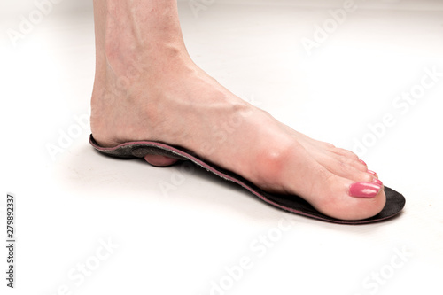 woman's foot on the orthopedic insole