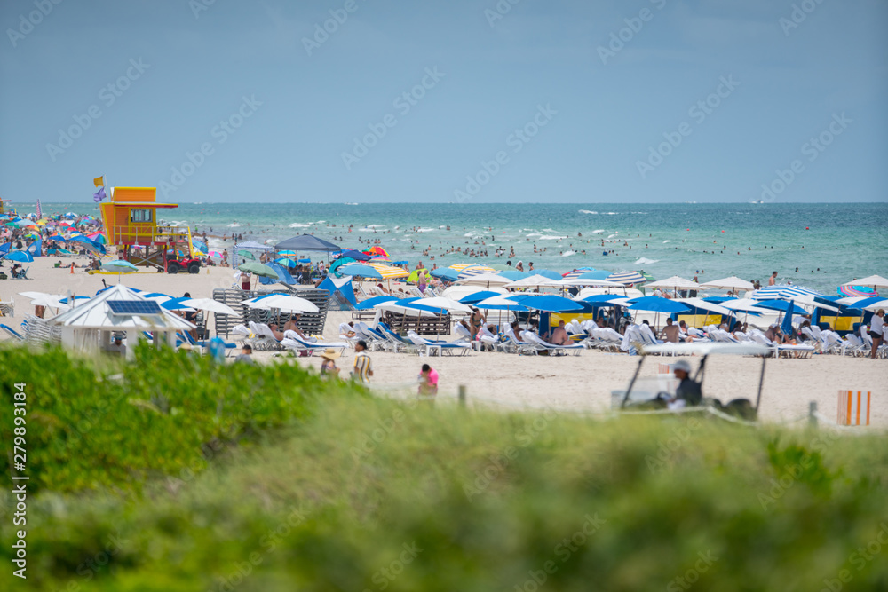Tourists on Miami Beach. Getting ready for a day at the beach Tourists on Miami Beach. Getting ready for a day at the beach