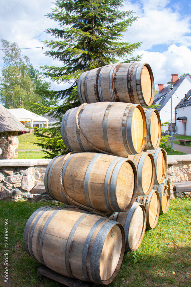 Wine barrels stacked in the form of a pyramid. Wine barrels stacked in the form of a pyramid.