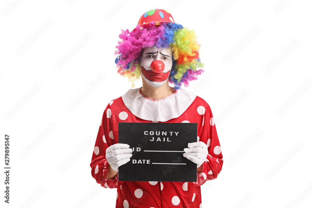 Sad clown posing with a jail board Sad clown posing with a jail board