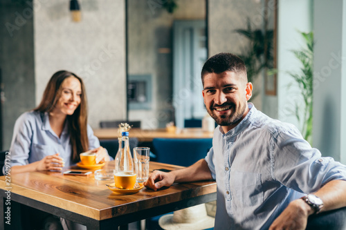 young couple in cafe bar drinking coffee