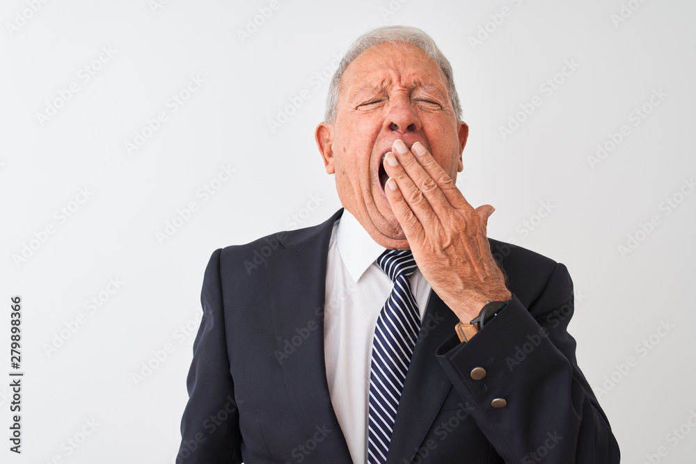 Senior grey-haired businessman wearing suit standing over isolated white background bored yawning tired covering mouth with hand. Restless and sleepiness. Senior grey-haired businessman wearing suit standing over isolated white background bored yawning tired covering mouth with hand. Restless and sleepiness.