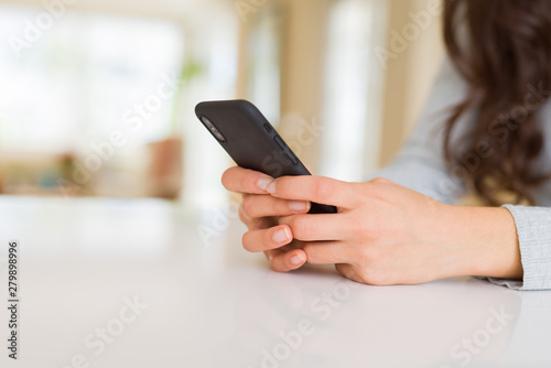Close up of woman hands using smartphone