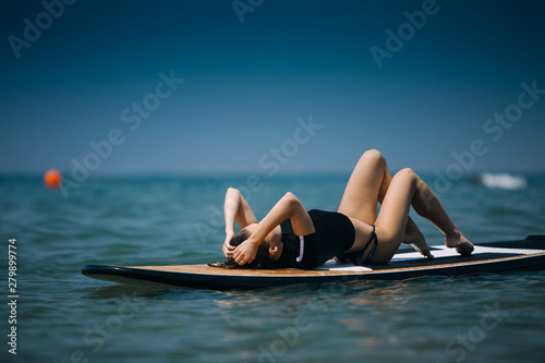 Sexy woman on the sup board. Girl on surfing board