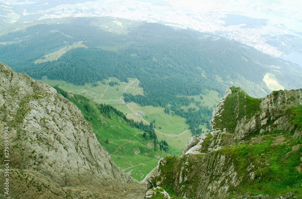 Naklejka premium Fantastic view from the height of the Pilatus mountain range. Summer green landscape. Hiking in Lucerne, Switzerland.