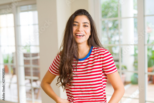 Beautiful brunette woman smiling cheerful, looking happy and positive Free Download Beautiful brunette woman smiling cheerful, looking happy and positive - GFXLoad