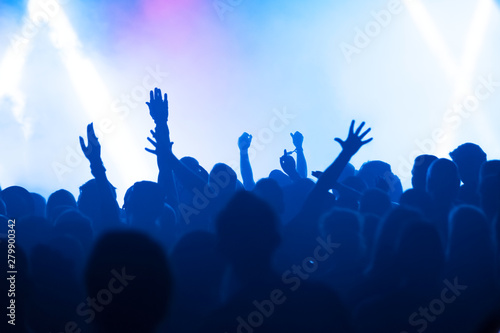silhouettes of audience at rock concert