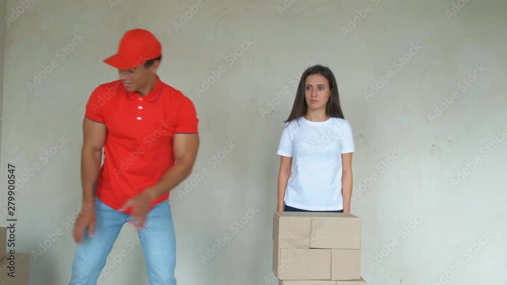 Delivery man gives the customer a lot of paper boxes