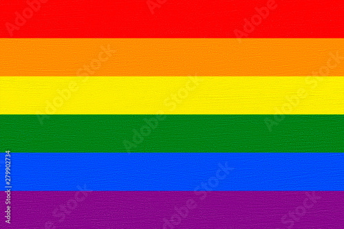 LGBT flag colors over wooden textured background. Gay pride