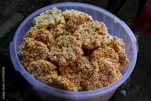 Traditional crisp crackers names rengginang Indonesian snack made of deep-fried rice photo