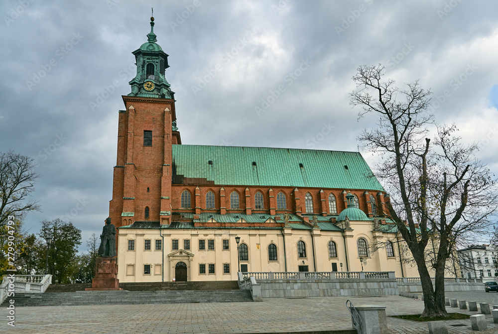 Gothic cathedral church with towers in autumn in Gniezno .