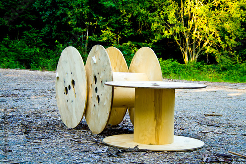 Three empty cable drums discarded in a Bavaria forest of Deutschland photo