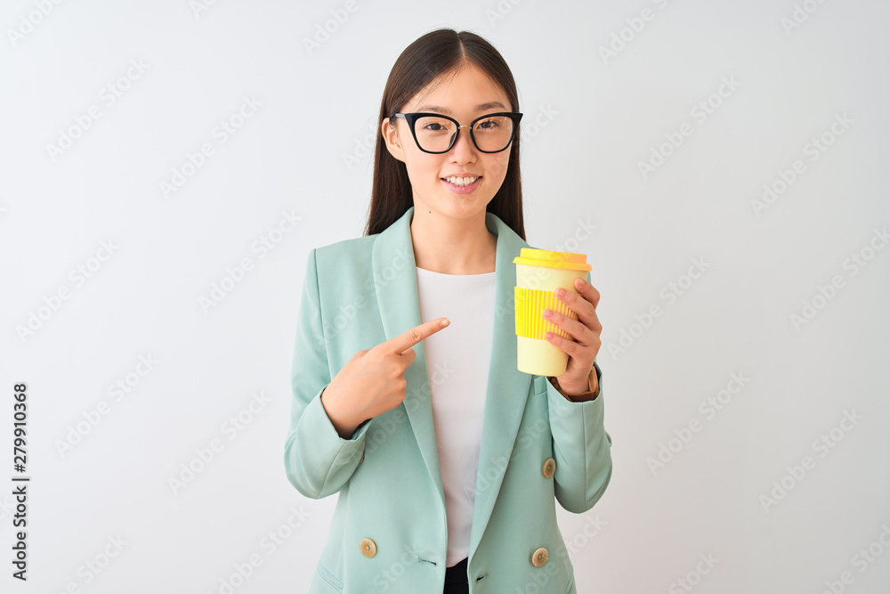 Young chinese woman wearing glasses drinking coffe over isolated white background very happy pointing with hand and finger Young chinese woman wearing glasses drinking coffe over isolated white background very happy pointing with hand and finger