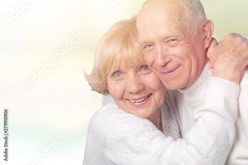 Portrait of happy senior couple smiling at home