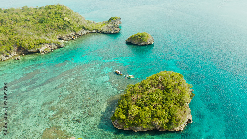 Turquoise lagoon with rocky island and corall reef, aerial view Boracay, Philippines. Summer and travel vacation concept.