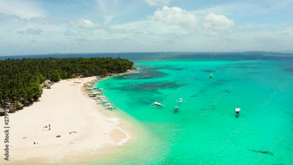 Sand beach and tropical islands, palm trees by atoll with coral reef, top view.Daco island, Philippines. Summer and travel vacation concept Sand beach and tropical islands, palm trees by atoll with coral reef, top view.Daco island, Philippines. Summer and travel vacation concept