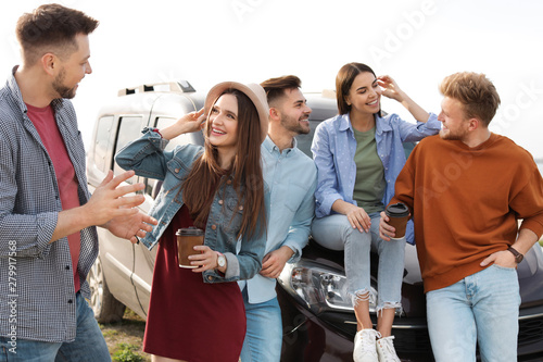 Group of happy people spending time together outdoors