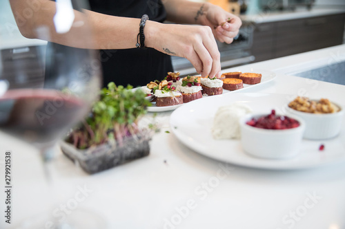 Quadro su tela Chef preparing appetizer in kitchen