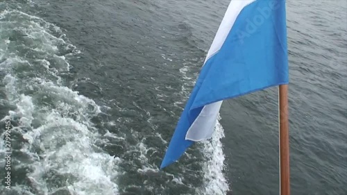 Ferry With Blue Waving Flag