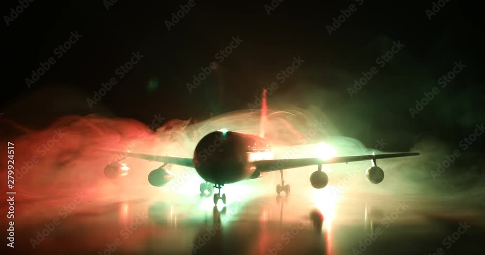Artwork decoration. White passenger plane ready to taking off from airport runway. Silhouette of Aircraft during night time. Selective focus