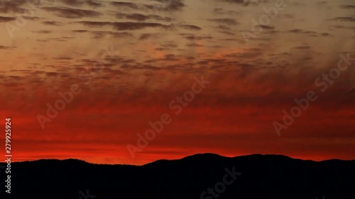 Panning shot of mountains at sunset photo