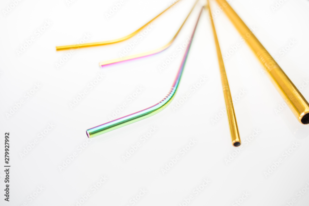 Environmental friendly stainless steel reusable drinking straws on white background. Different size and shape and color. Environmental friendly stainless steel reusable drinking straws on white background. Different size and shape and color.