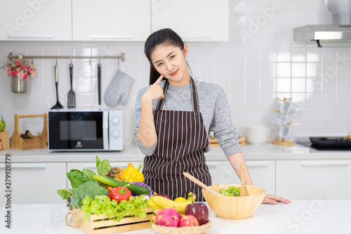 Young women are happy in the modern kitchen with healthy food  healthy food ideas and weight loss  copy space.