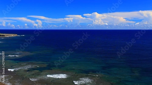 Rocky sea coast in summer with clear line of horizon in background photo