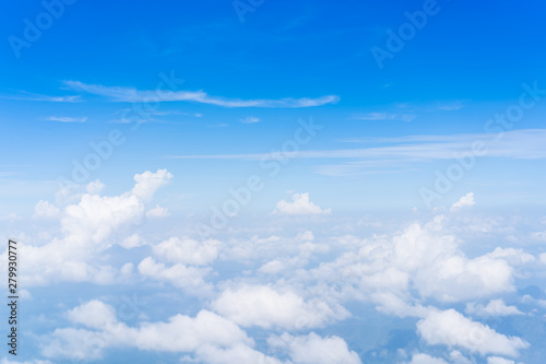 Group of the clouds in the sky from above angle. Beautiful blue sky and clouds from airplane background.