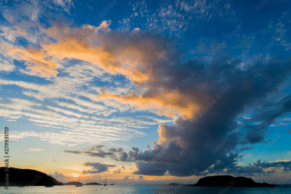 Fototapeta premium A cloudy sunset over Cinnamon Bay, St. John, USVI