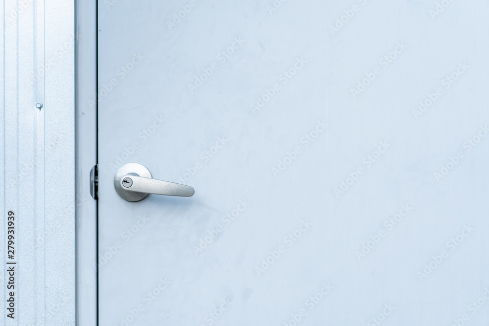 Metal door knob, door handle, in metal door close up. Metal door knob, door handle, in metal door close up.