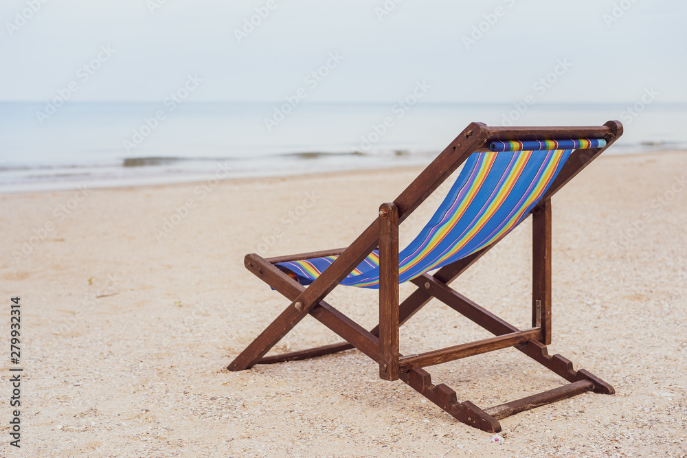 Vintage wooden bed at the beach with copy space. Concept of vacation, leisure, holiday and relaxing. Processed in vintage color tone